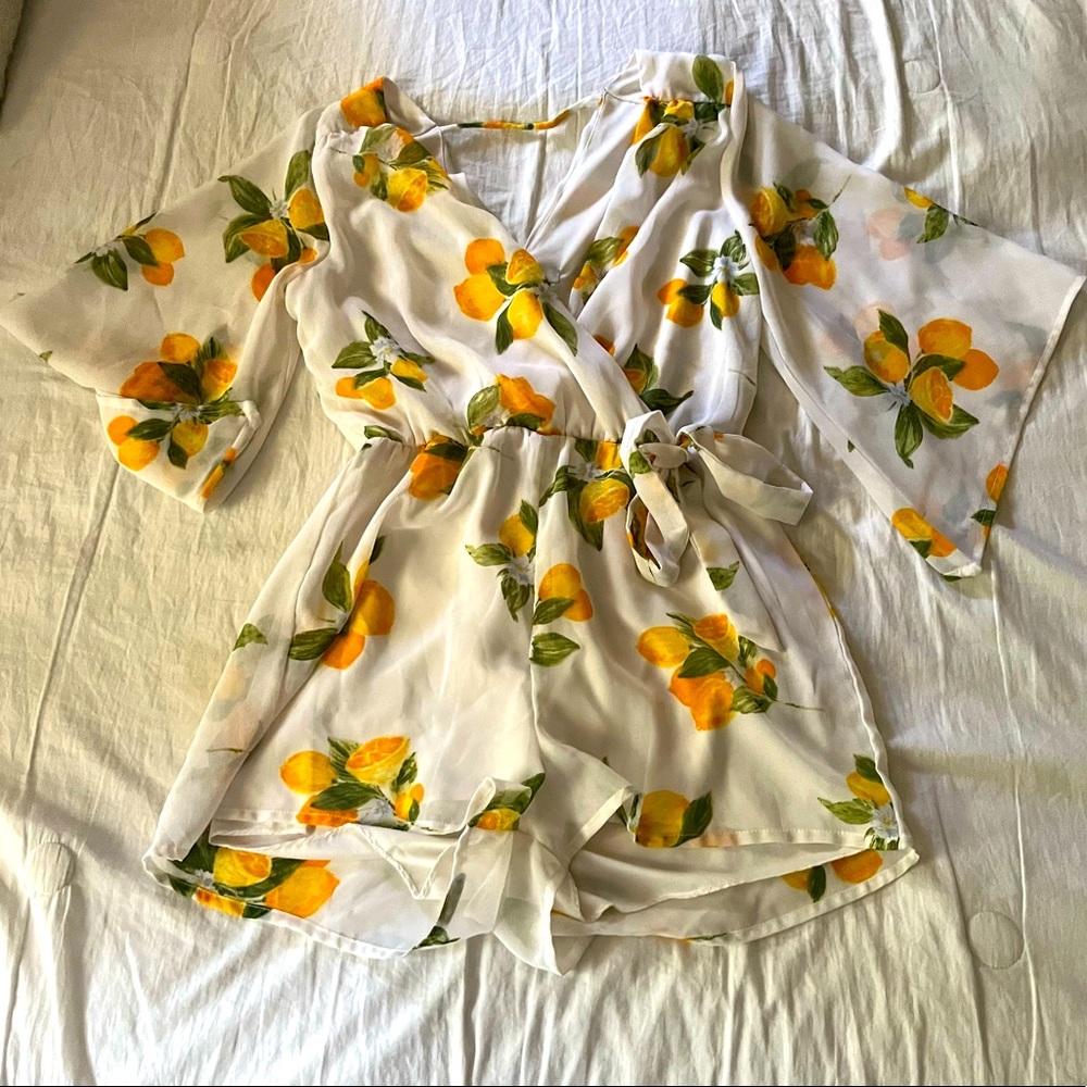 Bailey Blue Lemon chiffon romper with bell quarter sleeves.